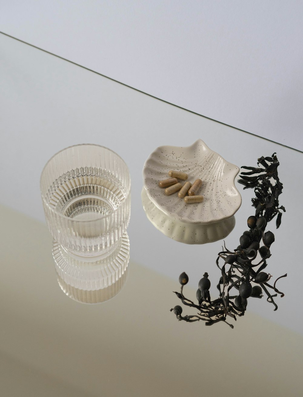 a glass bowl and a plate on a table