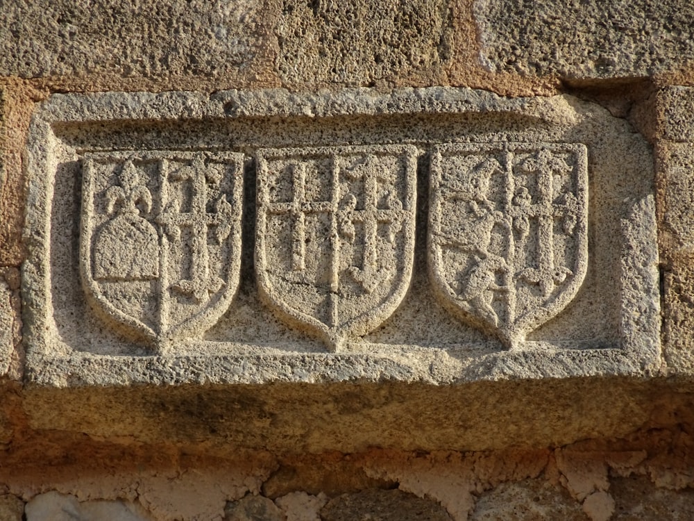 a close up of a stone carving on a wall