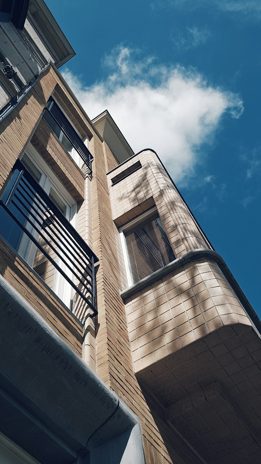 a tall building with a balcony and balconies