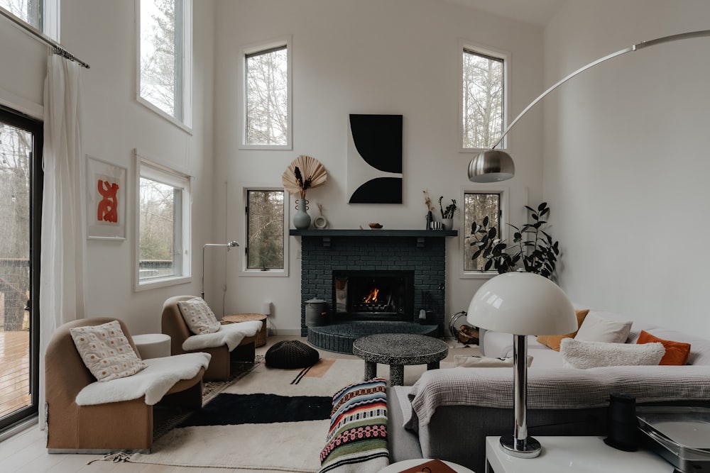 a living room filled with furniture and a fire place