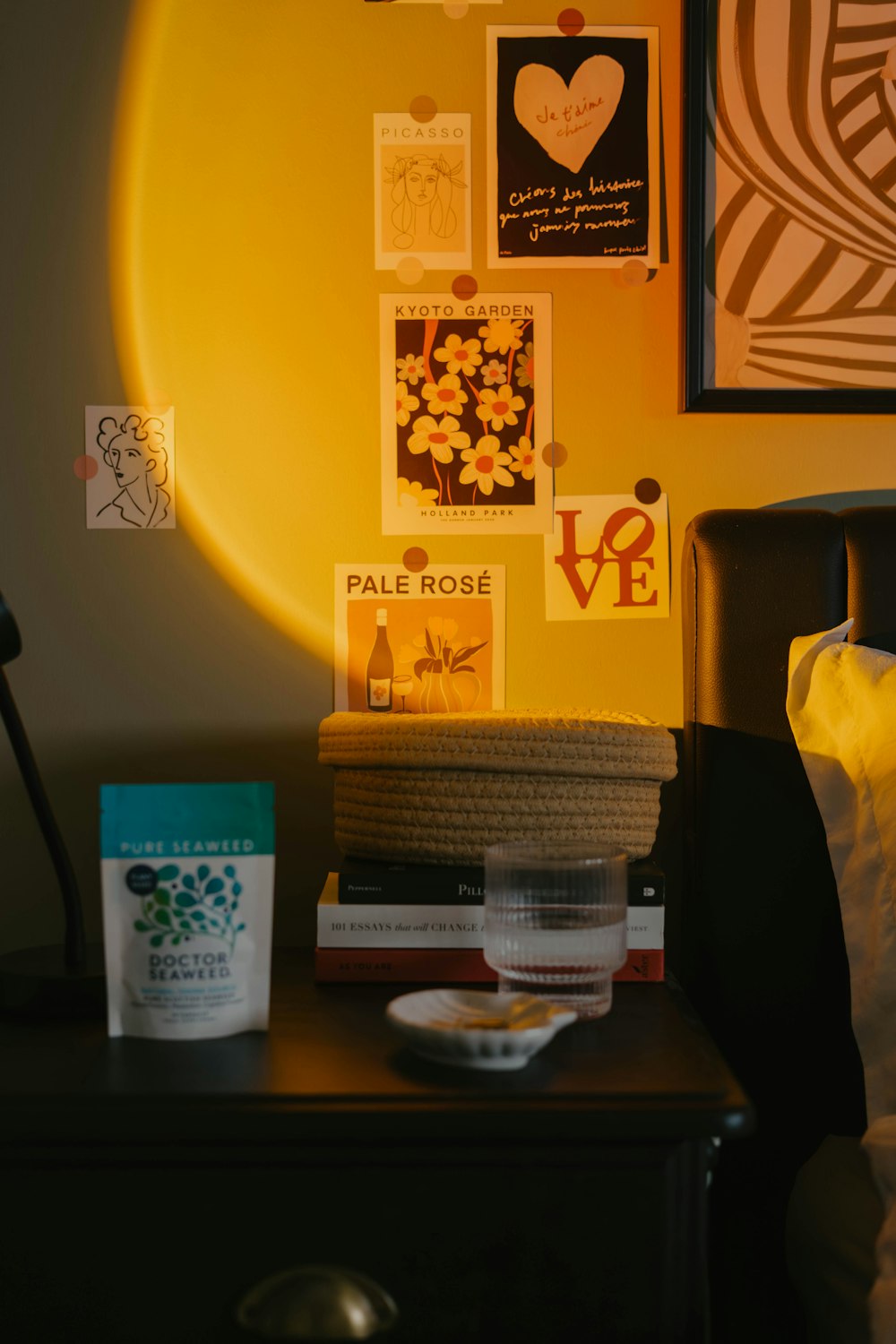 a bed room with a neatly made bed and a night stand