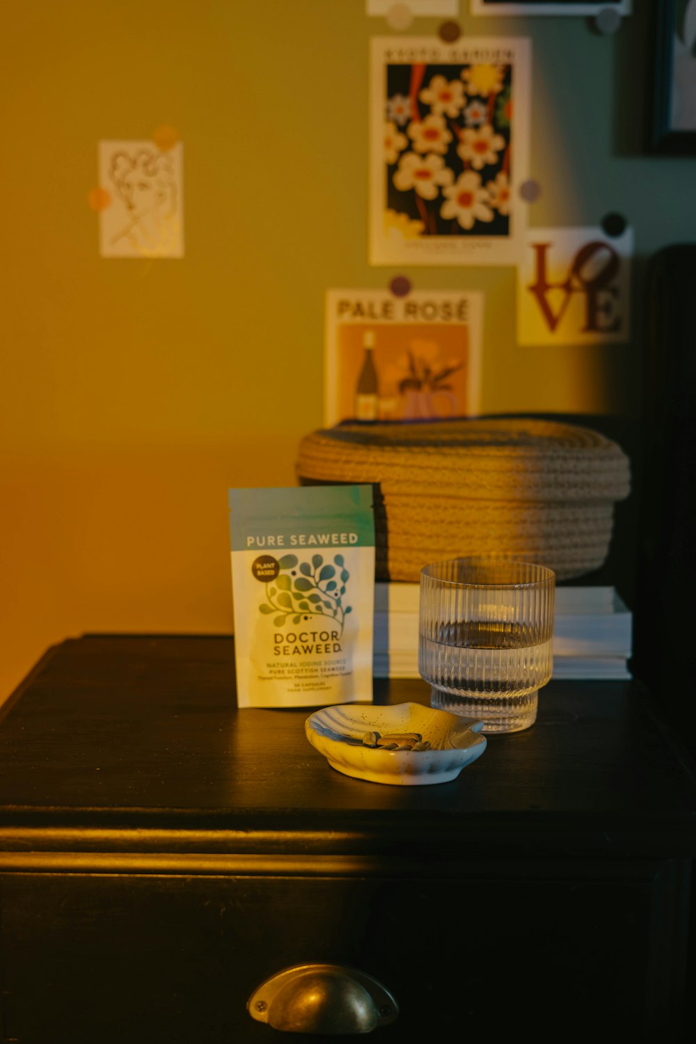 a table with a bowl and a glass on it