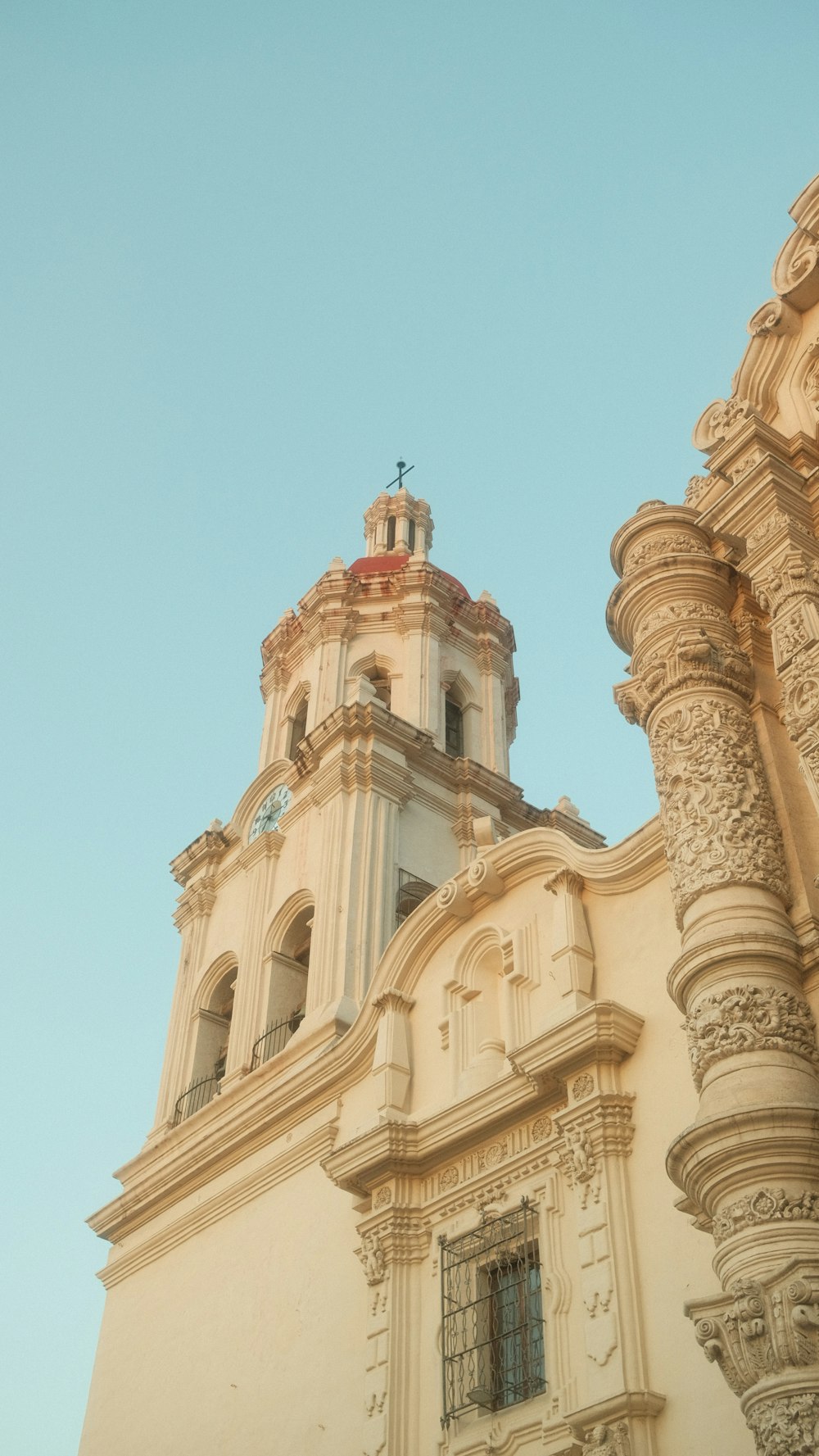 a tall building with a clock on the top of it