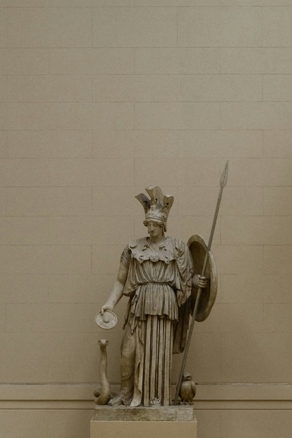a statue of a man holding a shield and a sword