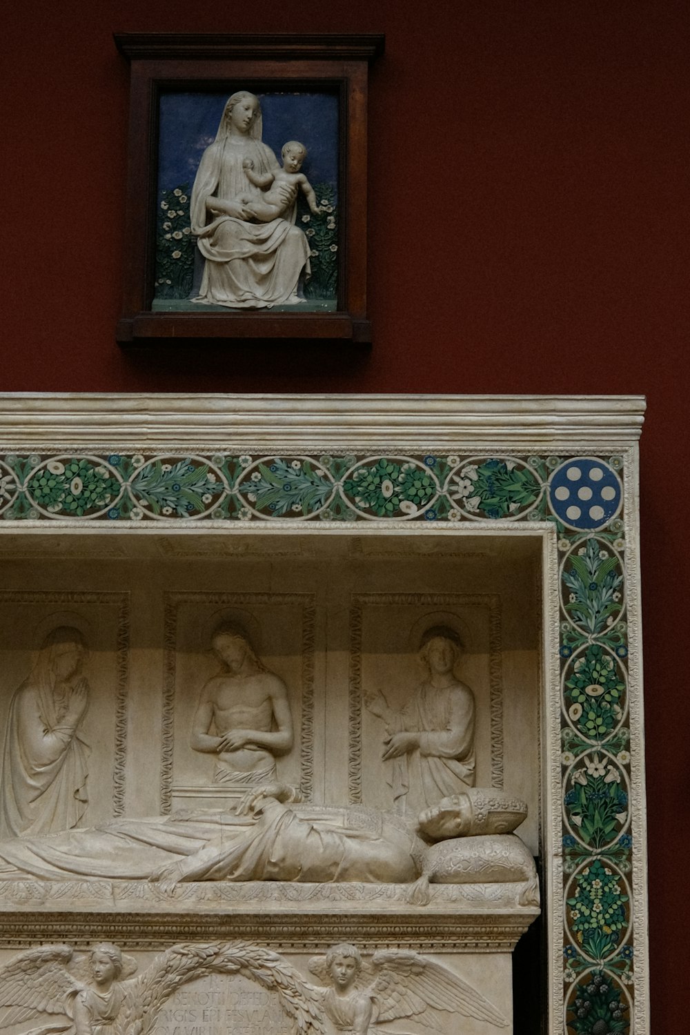 a statue of a woman laying on a bed