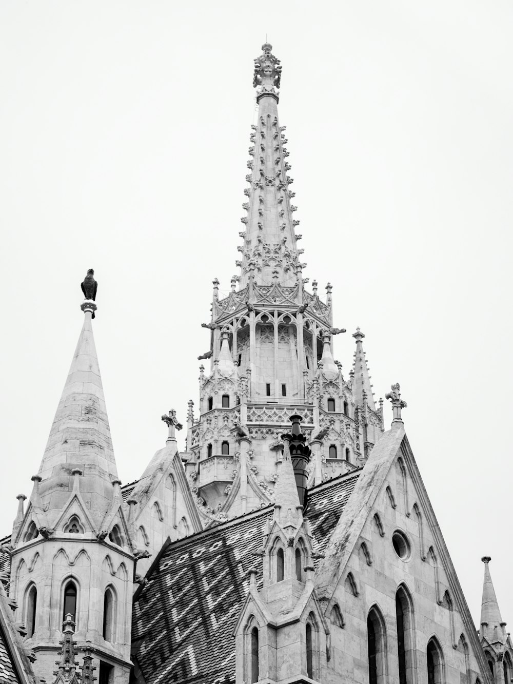 a black and white photo of a building with a steeple