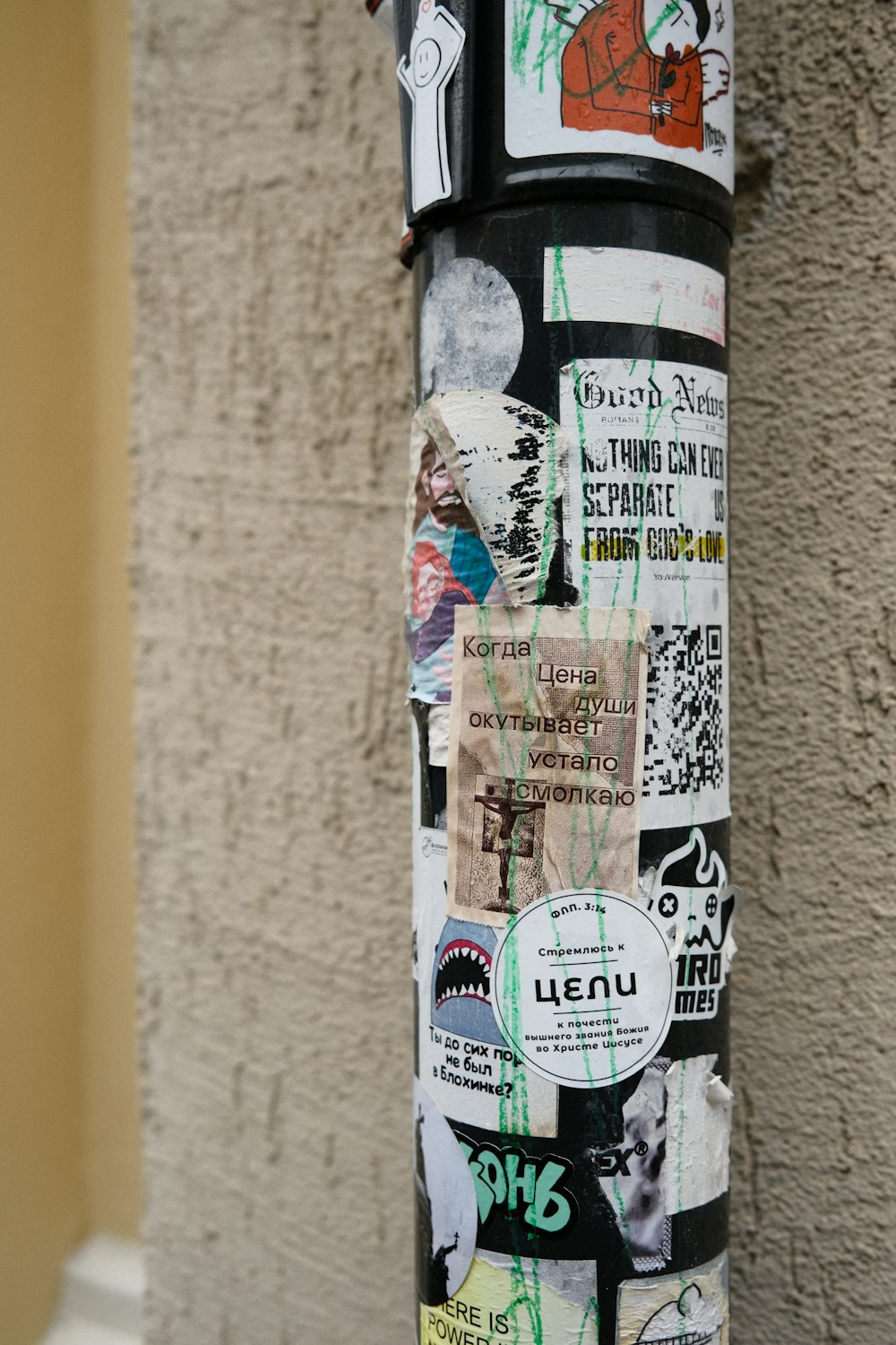 a pole with a lot of stickers on it