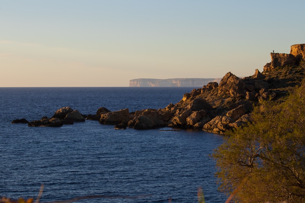 a large body of water surrounded by rocks