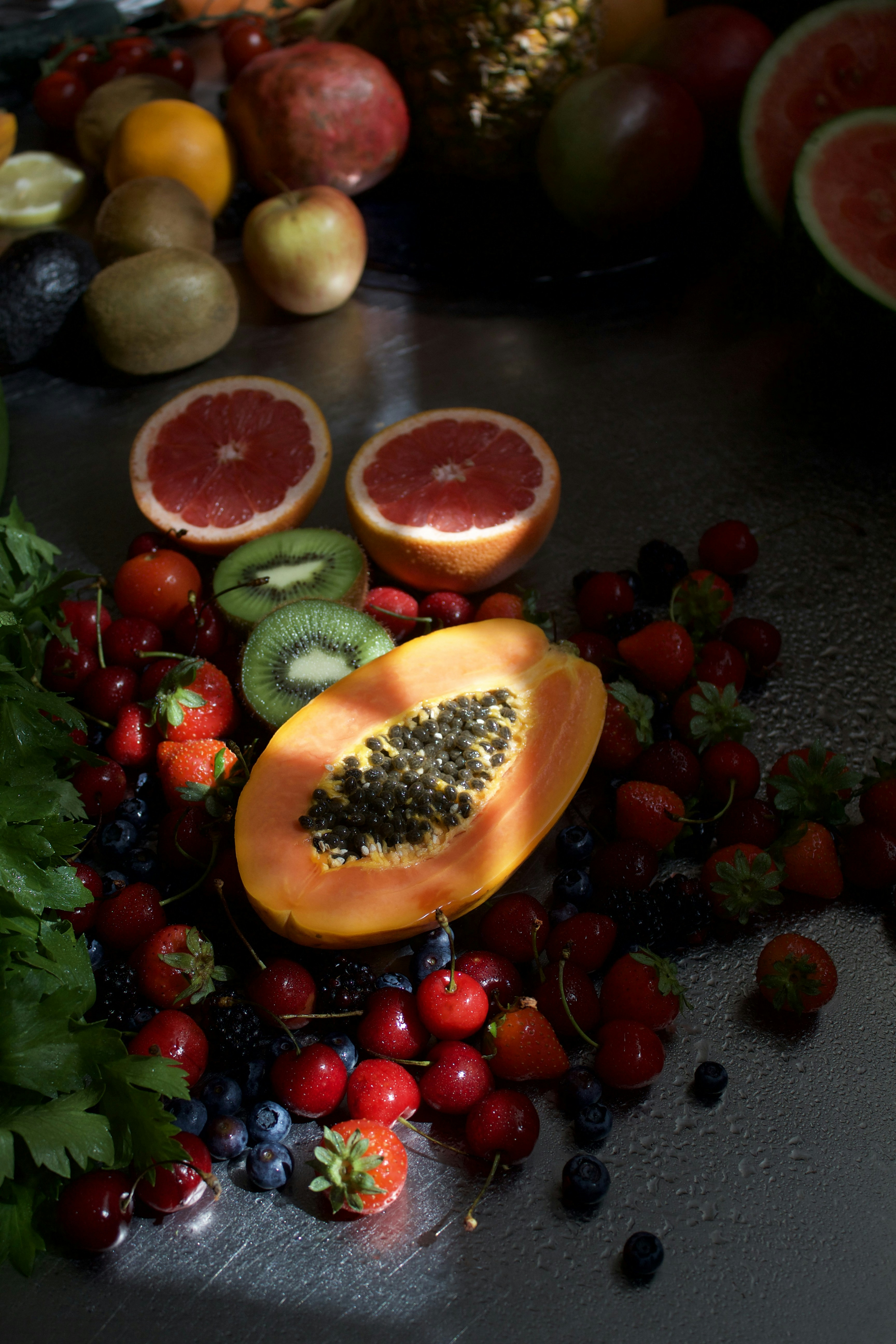 a table topped with lots of fruits and veggies