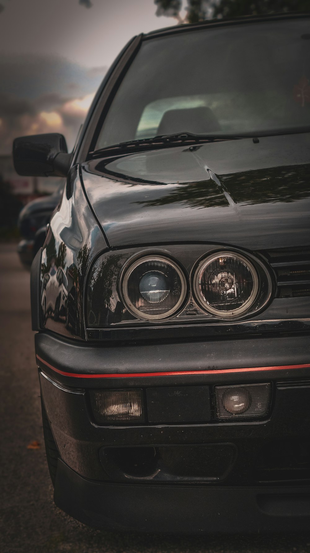 a close up of the front of a black car