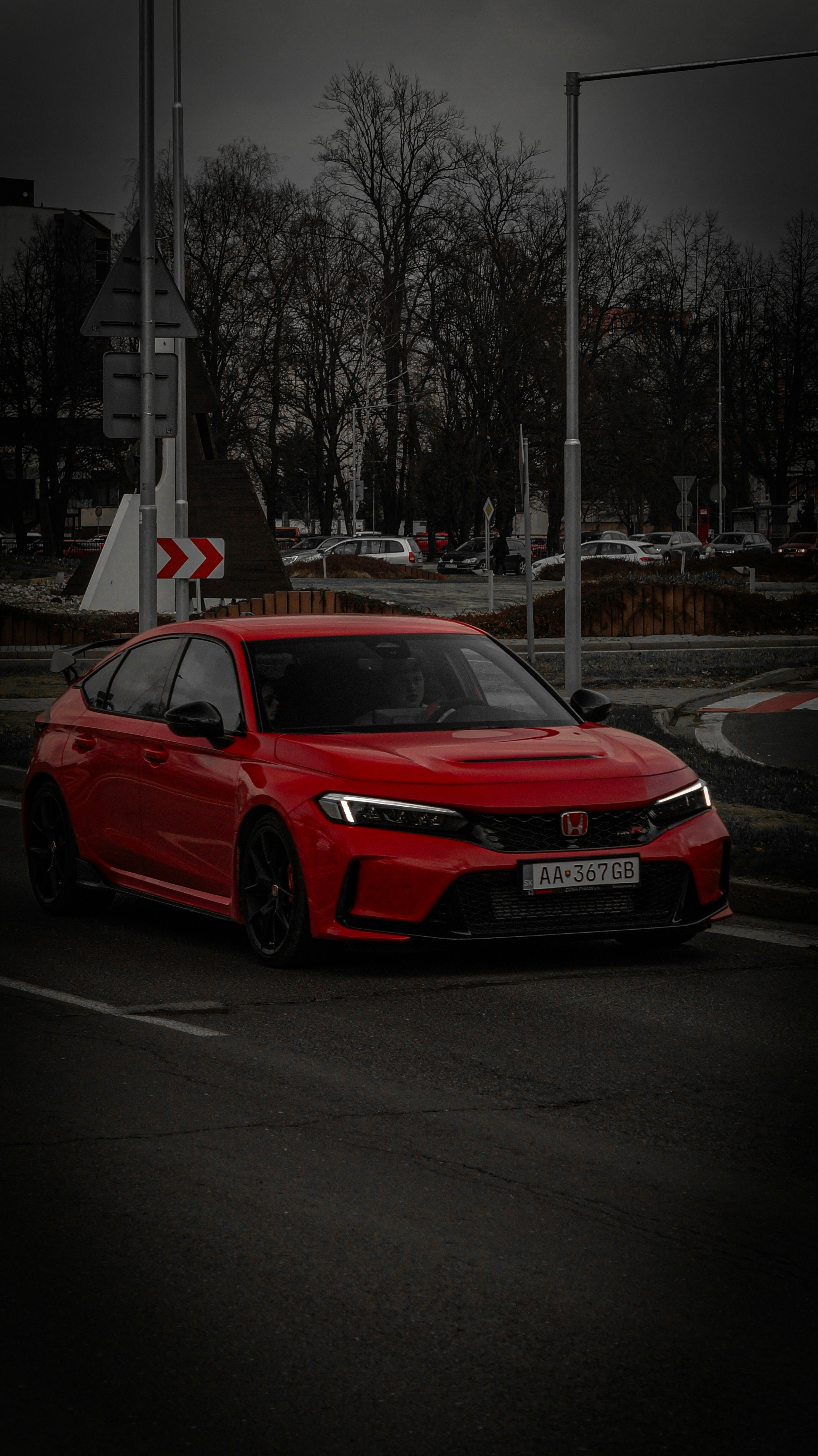a red car parked in a parking lot