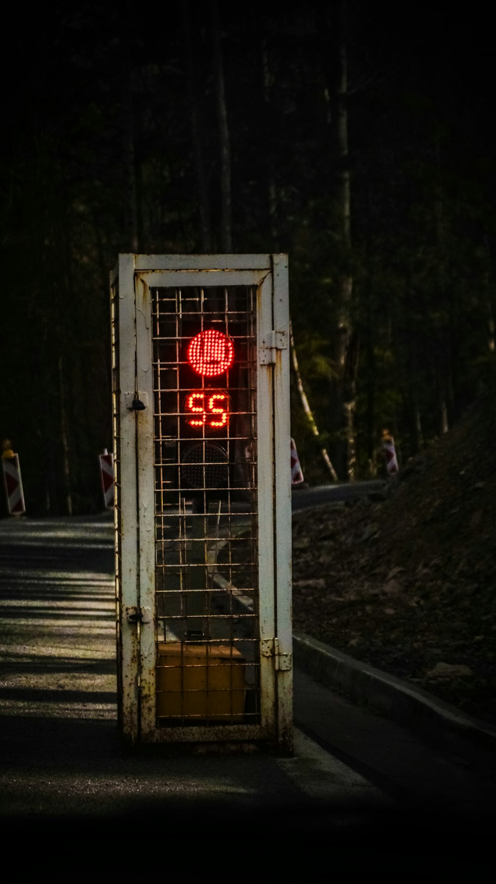 a gate that has a red light on top of it