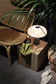 a pair of shoes and a table with a lamp on it