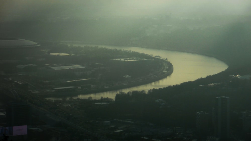 an aerial view of a river and a city