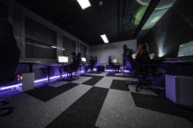 a group of people sitting at desks in a room