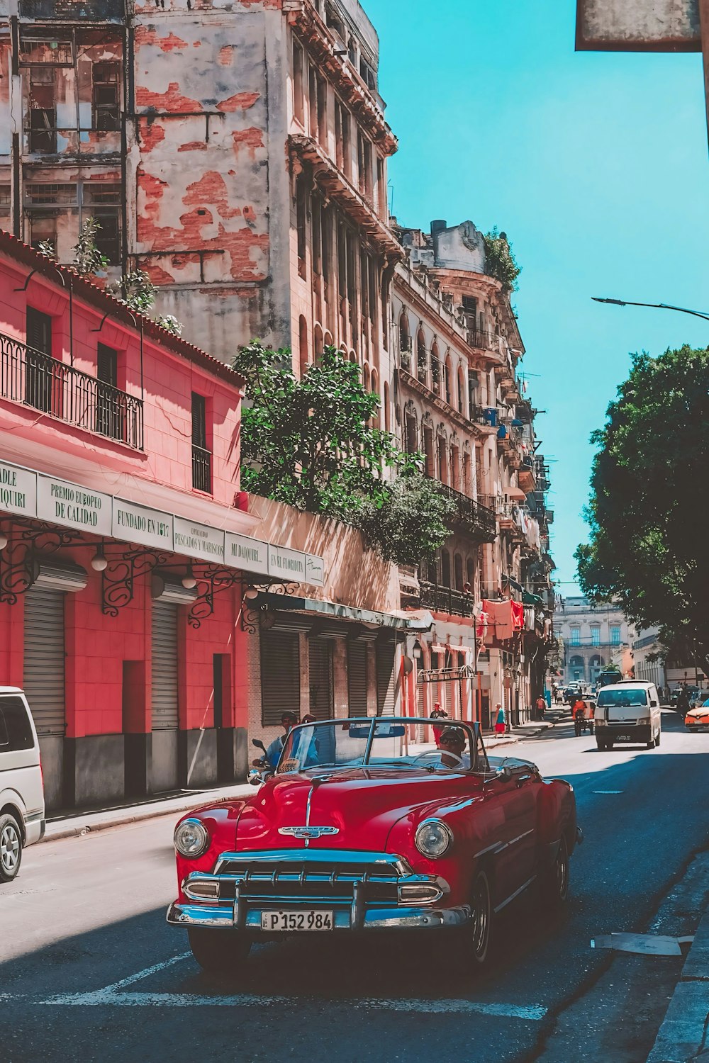 a red car parked on the side of the road