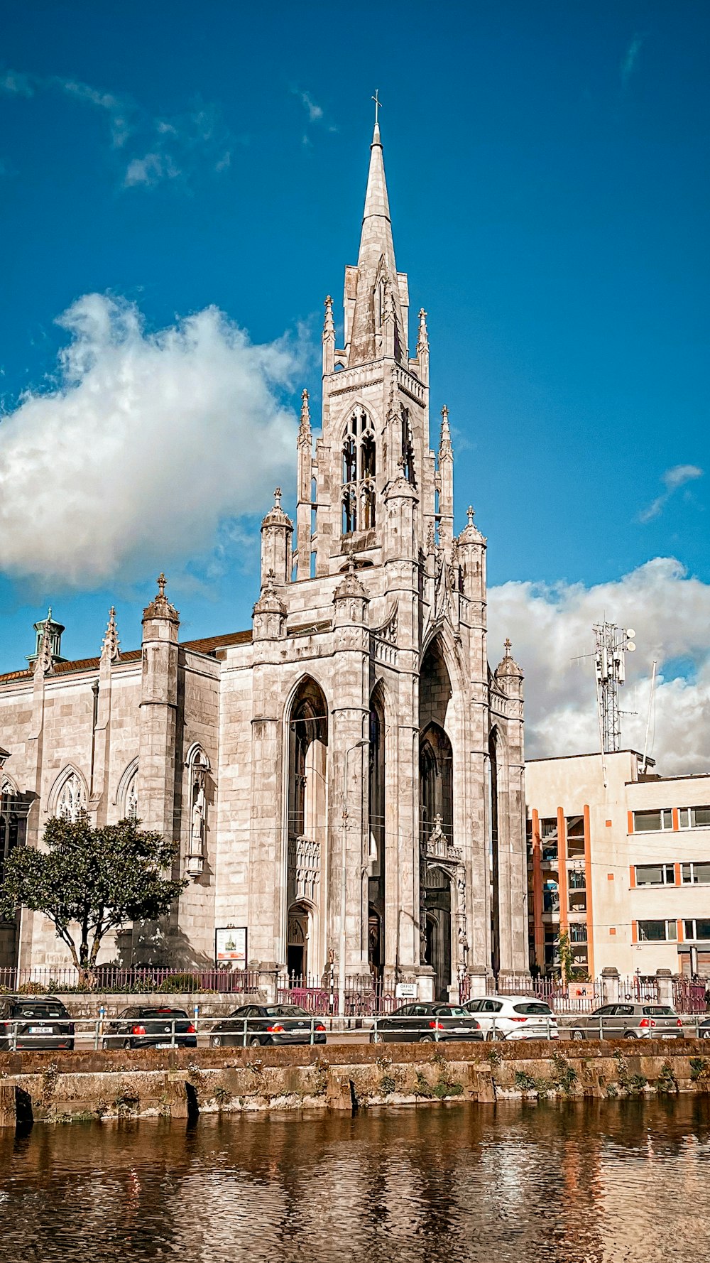 a large cathedral with a clock on the front of it