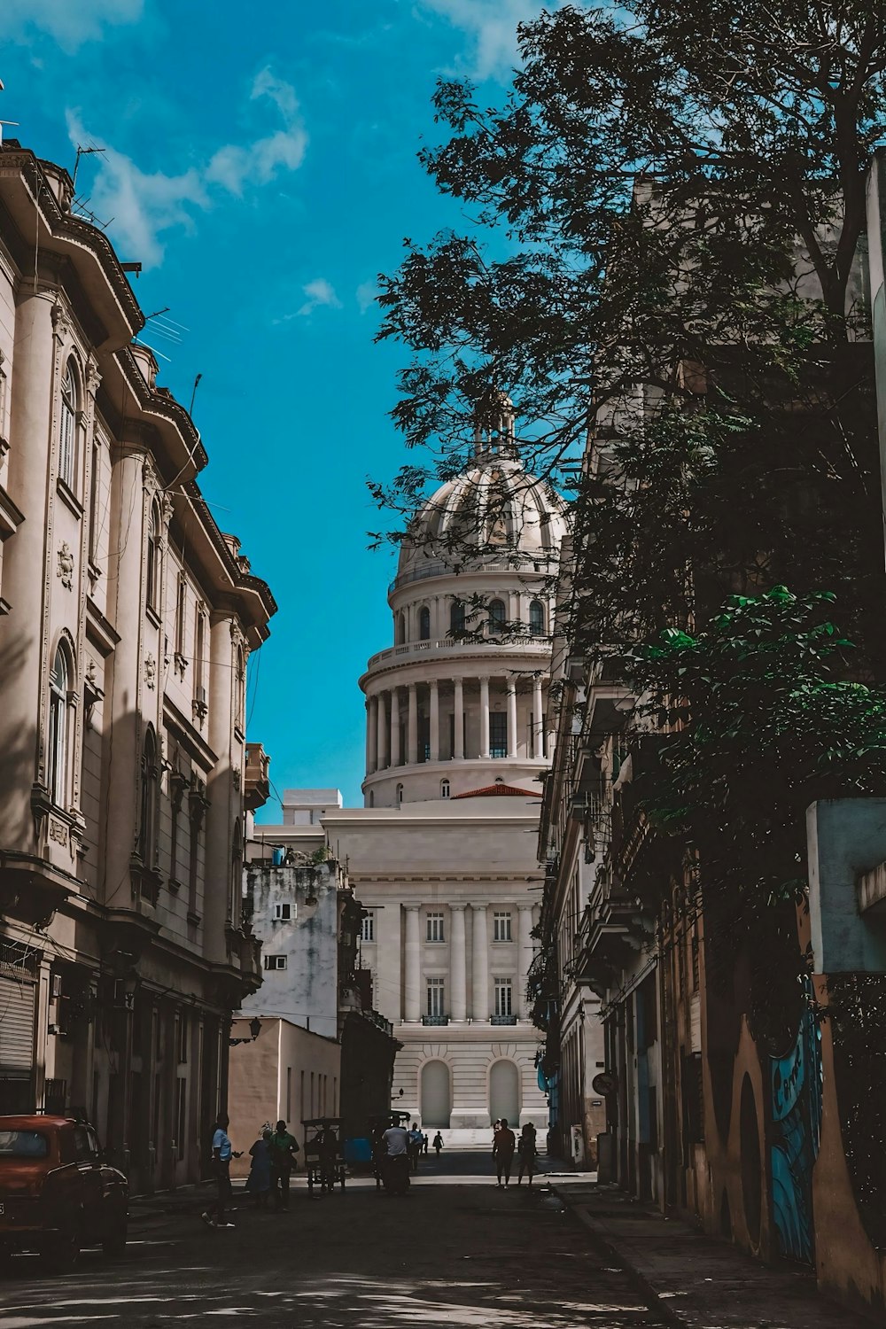 a city street with a building in the background