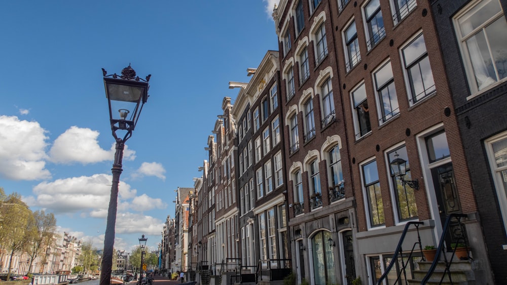 a street light in front of a row of buildings