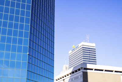 a tall building next to a very tall building