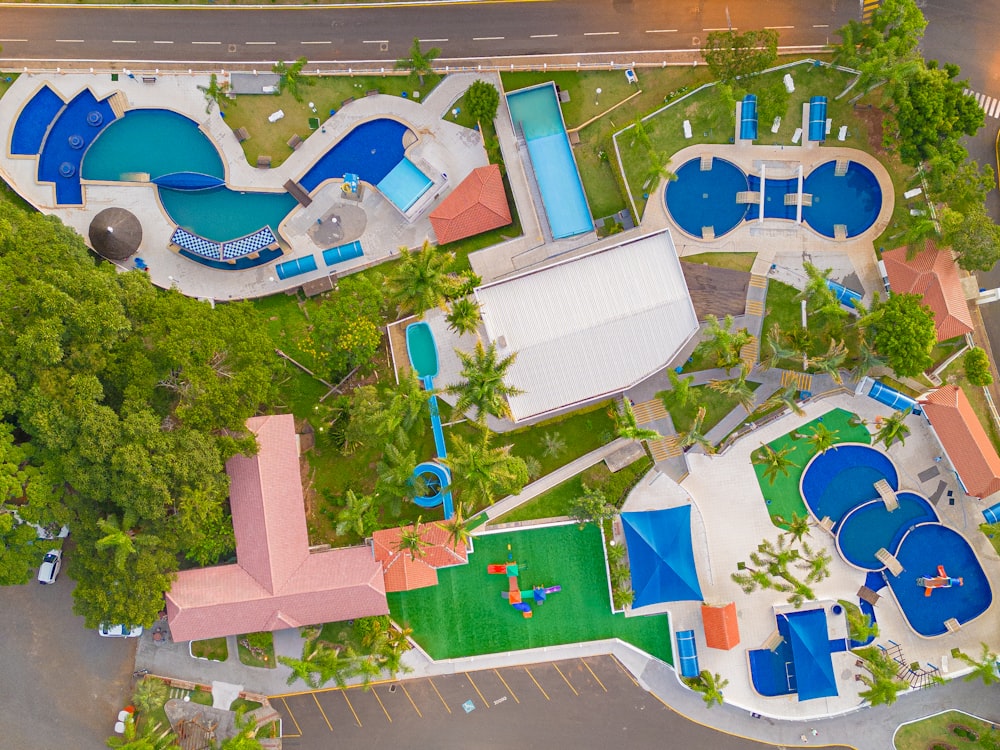 an aerial view of a resort with a swimming pool