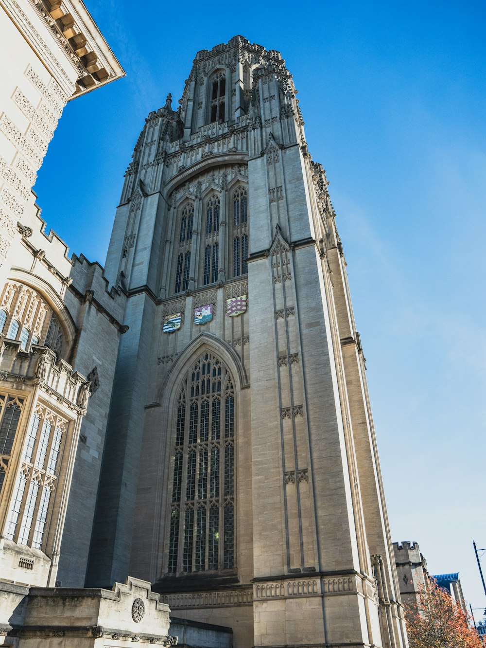 a very tall building with a clock on it's side