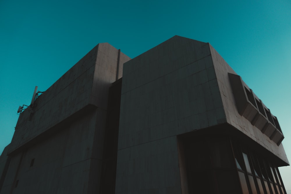 a tall building with a sky in the background