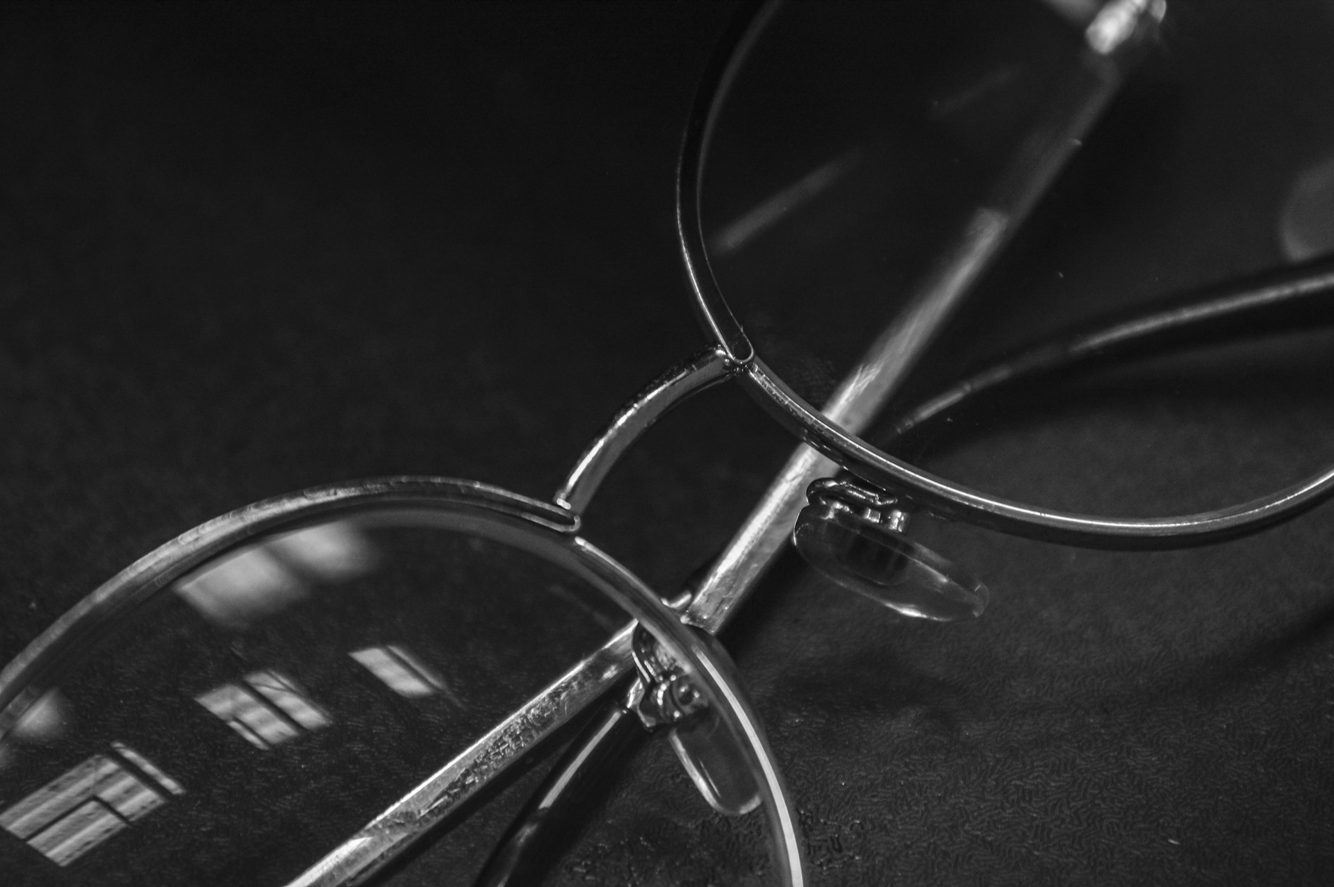 a black and white photo of a pair of glasses
