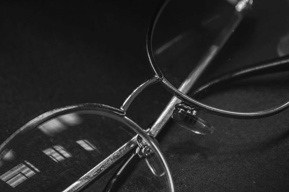 a black and white photo of a pair of glasses
