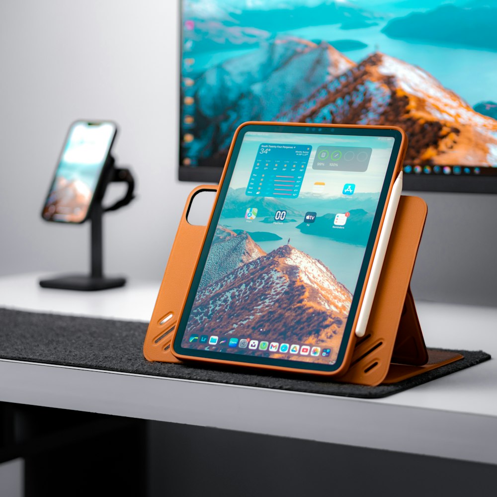 a cell phone and a tablet on a desk