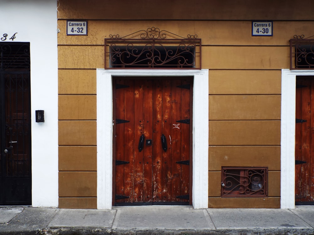 a couple of doors that are on the side of a building