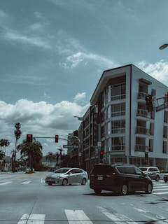a city street with cars stopped at a red light