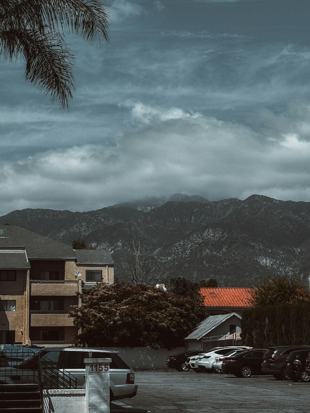 a parking lot with a mountain in the background