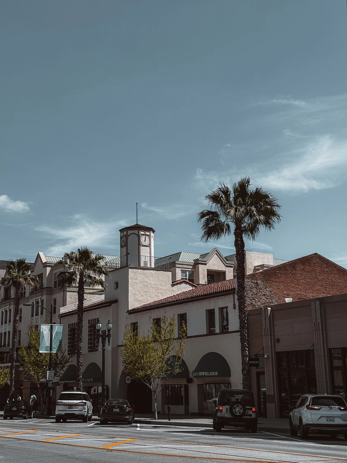 Pasadena street with palm trees and clock tower