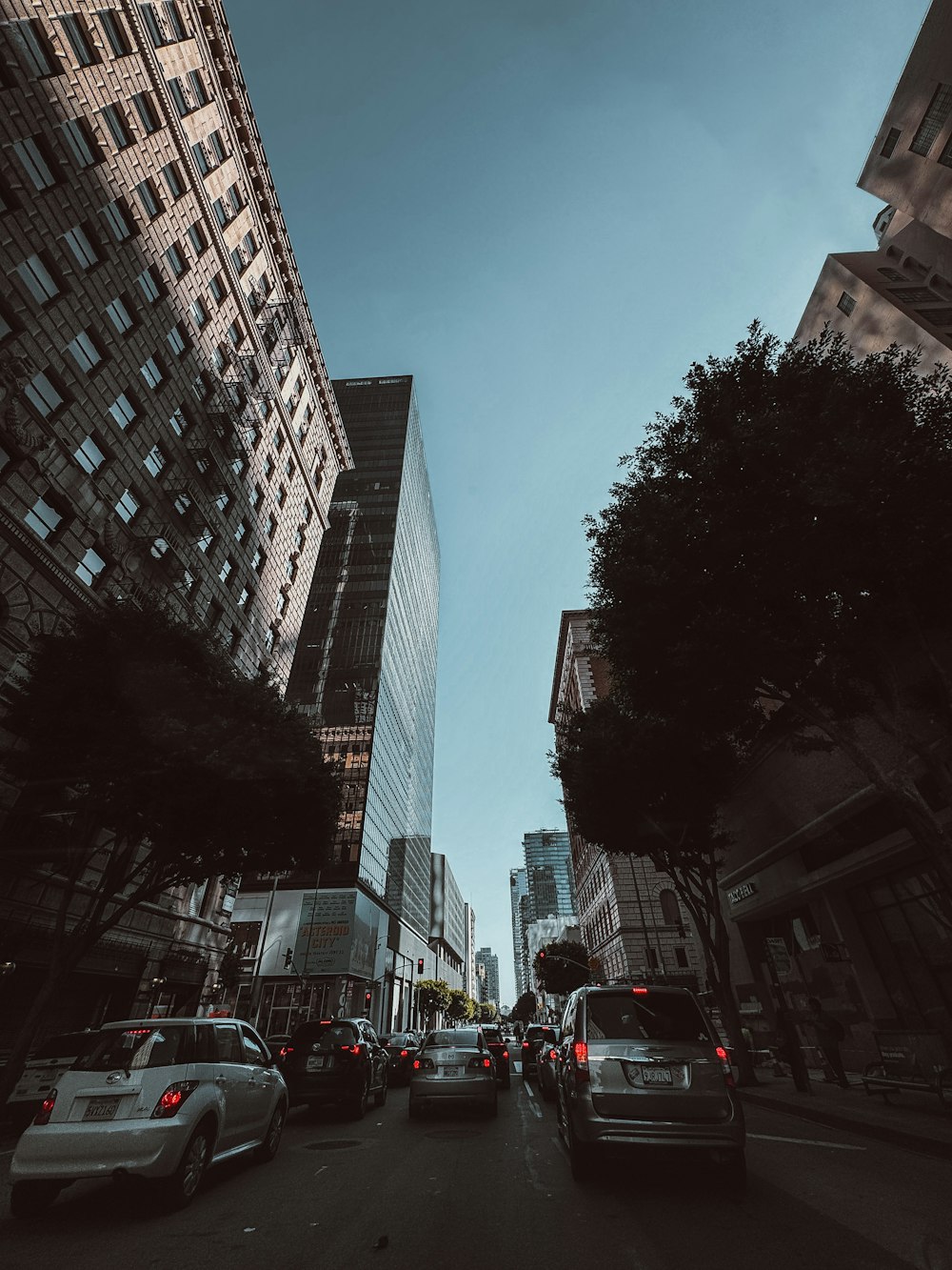 a city street filled with lots of tall buildings