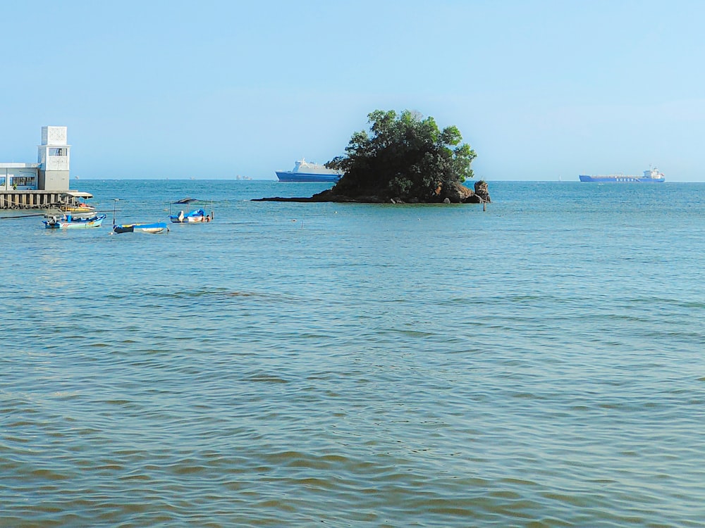 a body of water with a small island in the middle of it