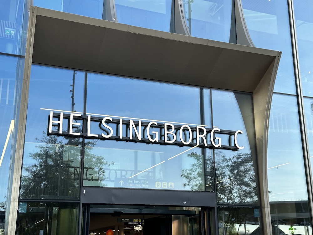 a large glass building with a sign that says helsingburgc