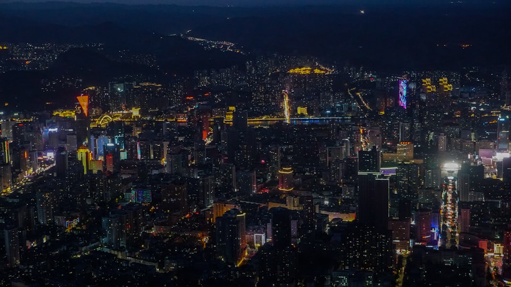 a view of a city at night from the top of a building