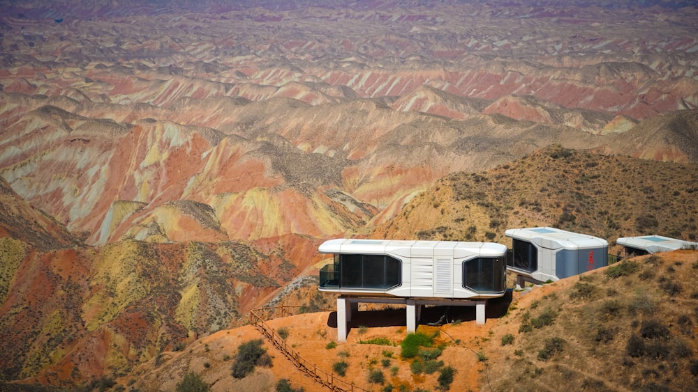 a couple of buildings sitting on top of a mountain