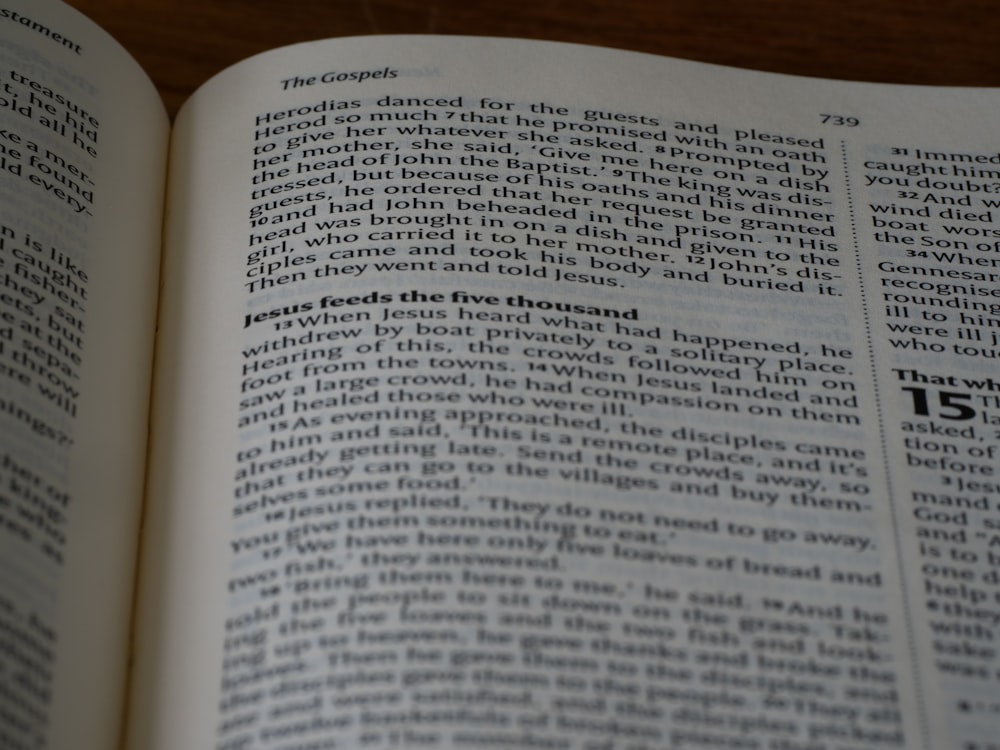 a close up of an open book on a table