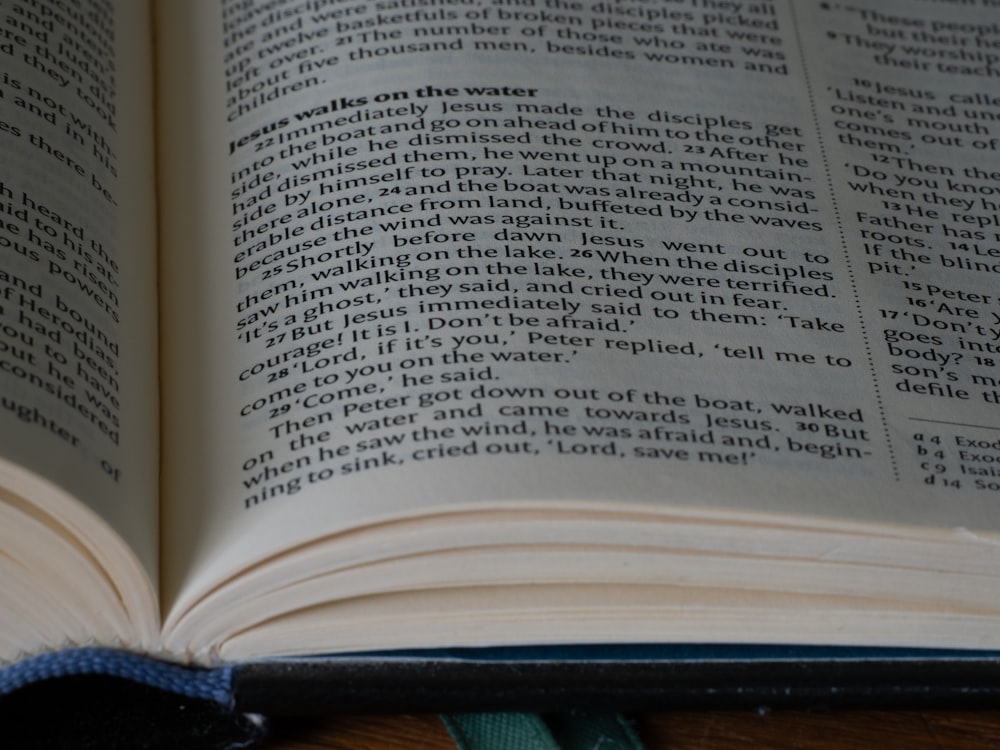 an open book sitting on top of a wooden table