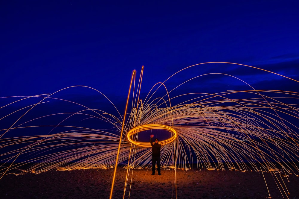 a man standing in front of a spinning object