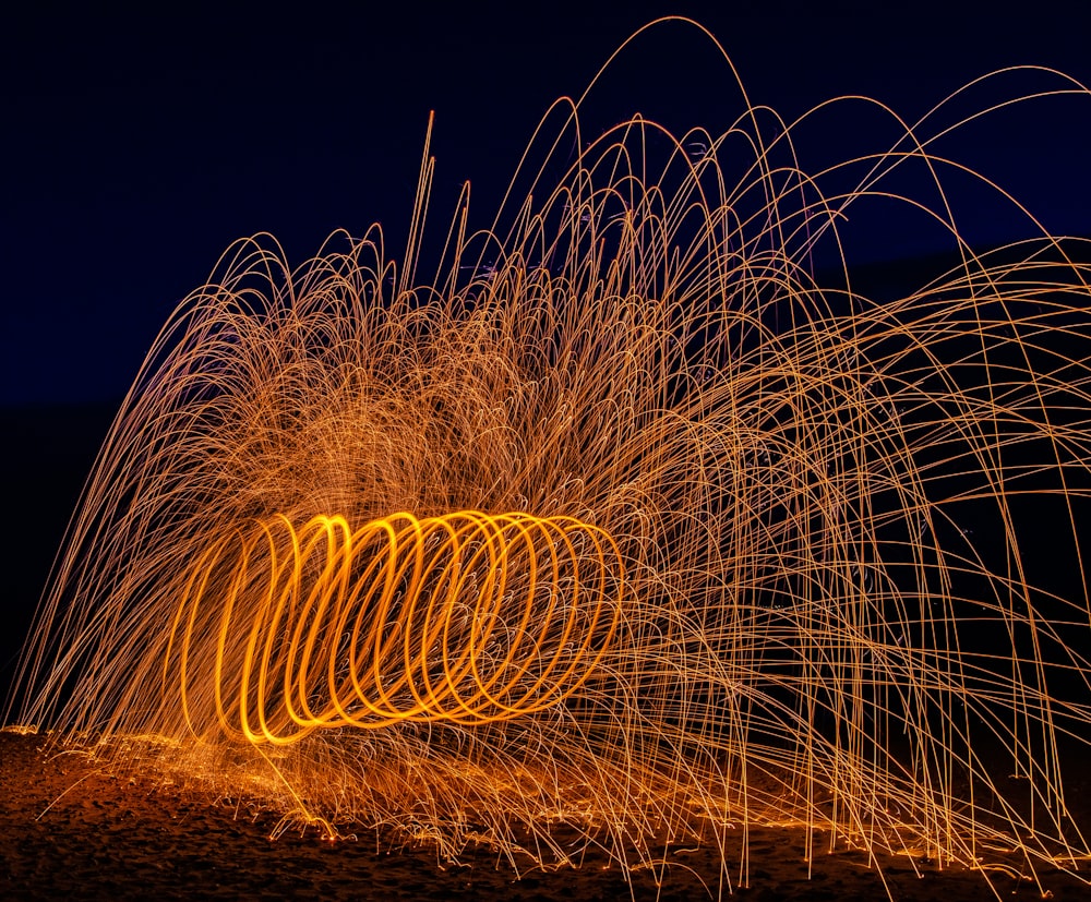 a long exposure photo of a firework display