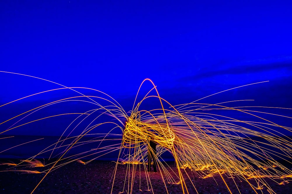 a long exposure of light painting on a beach