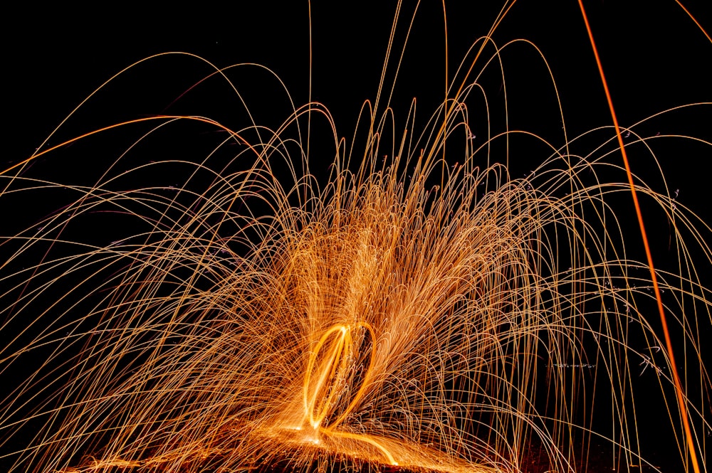 a long exposure of a firework at night