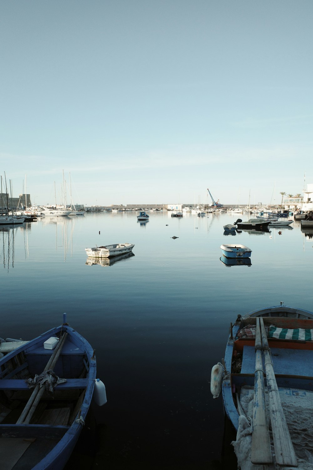 a group of boats floating on top of a body of water