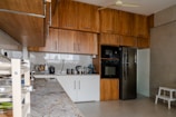 a kitchen with a refrigerator and a microwave