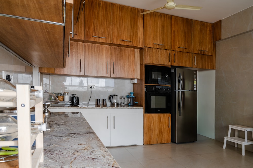 a kitchen with a refrigerator and a microwave