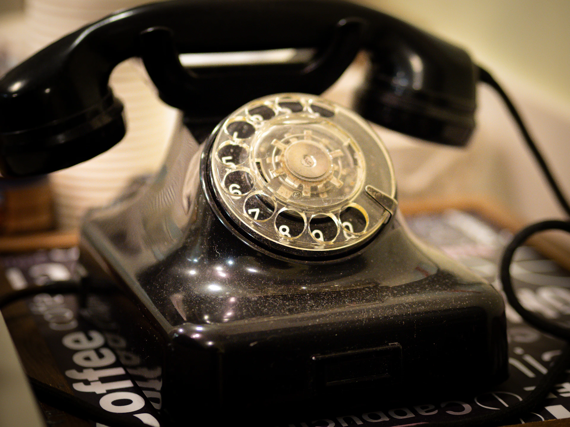 an old fashioned telephone sitting on top of a table