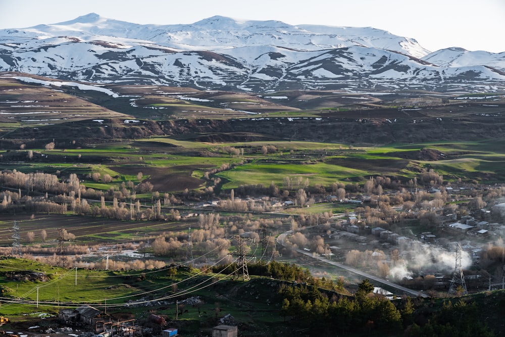 a view of a valley with a mountain in the background